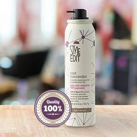 Spray de retouche racines Brun Clair sur table de beauté