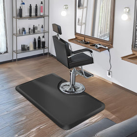 Tapis antifatigue Saloniture 3 ft x 5 ft noir sur un sol de salon