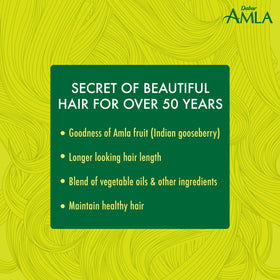 Texture de l'huile de cheveux Amla Dabur sur la main