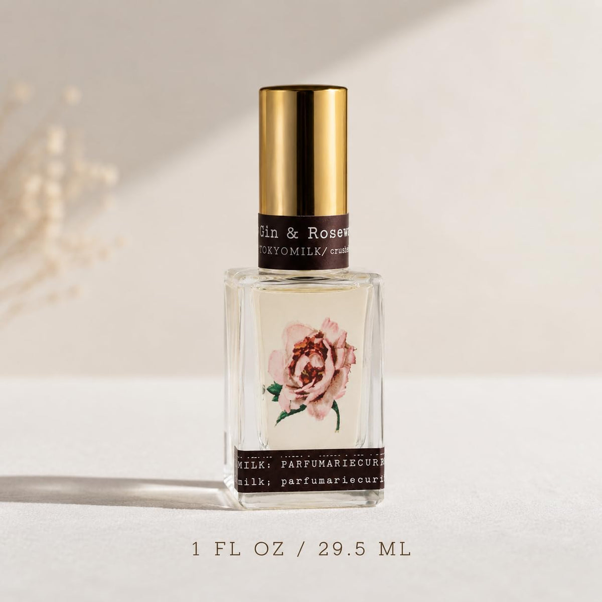 TOKYOMILK Eau de Parfum Gin & Rosewater sur table en bois