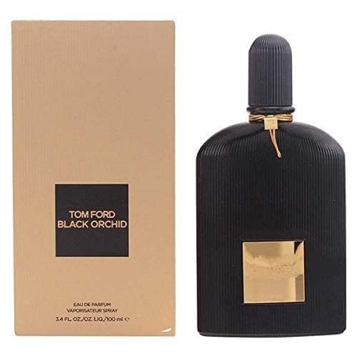 Tom Ford Black Orchid Eau de Parfum sur une table avec des fleurs