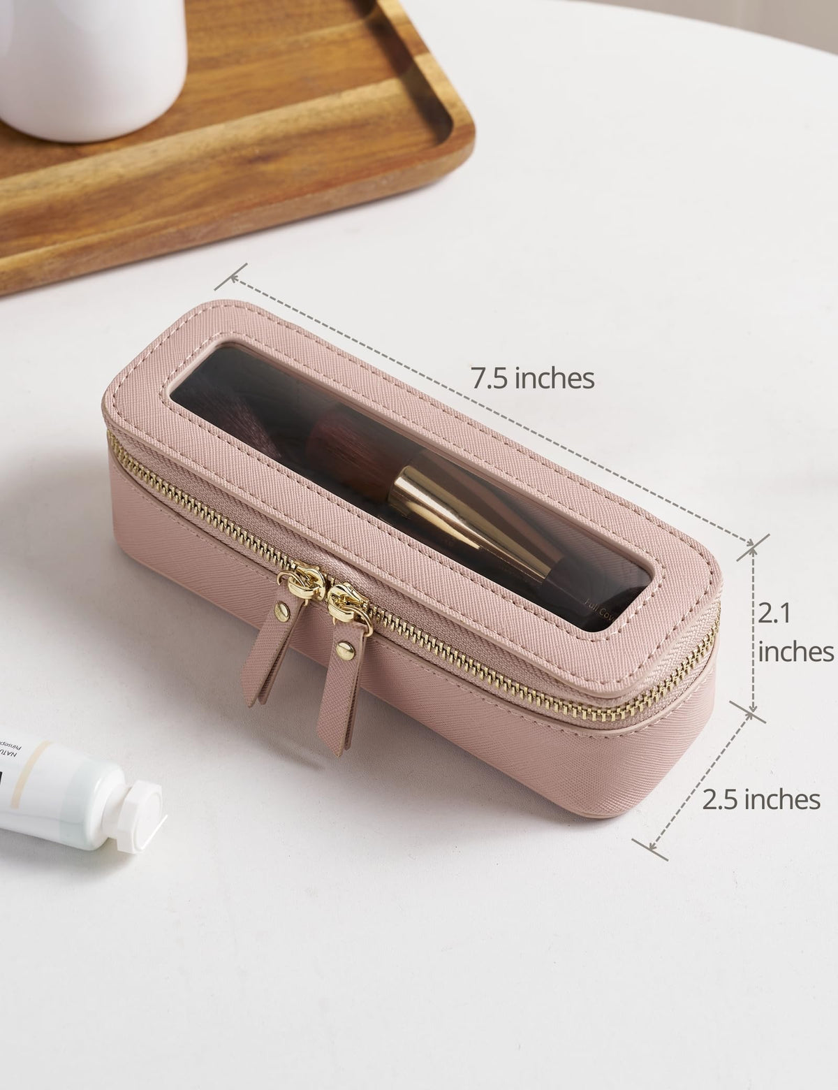 Trousse de maquillage Popvibe sur une table avec des cosmétiques à côté