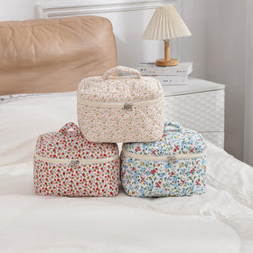 Trousse de maquillage uekeboag motif floral sur fond blanc