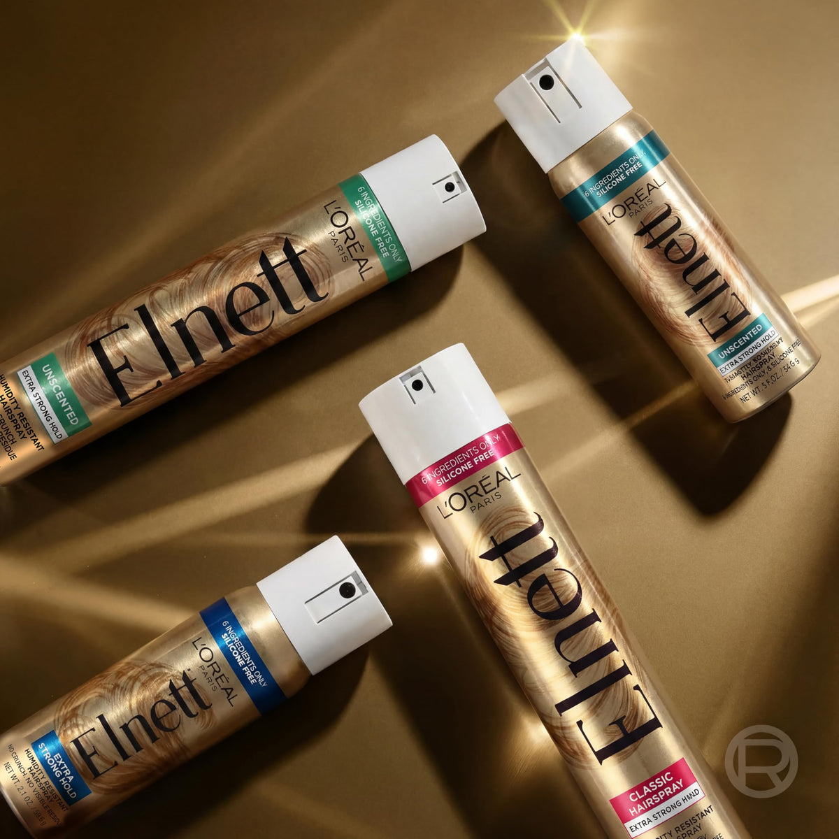 Vaporisation de la laque Elnett sur des cheveux bouclés