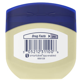 Vaseline Gelée de Pétrole Originale 1,75 oz à côté d'un produit de soin
